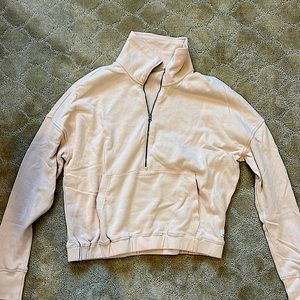 Light pink vuori lightweight sweatshirt